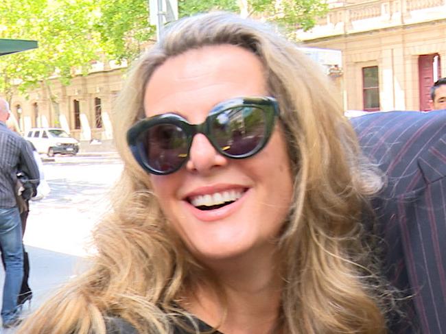 A screen-grab from a video footage showing former Health Services Union boss Kathy Jackson (centre) and her partner Michael Lawler (right) leave Melbourne's County Court where she is fighting charges she misappropriated almost $500,000 in union funds. (AAP Image/Alex Murray) NO ARCHIVING