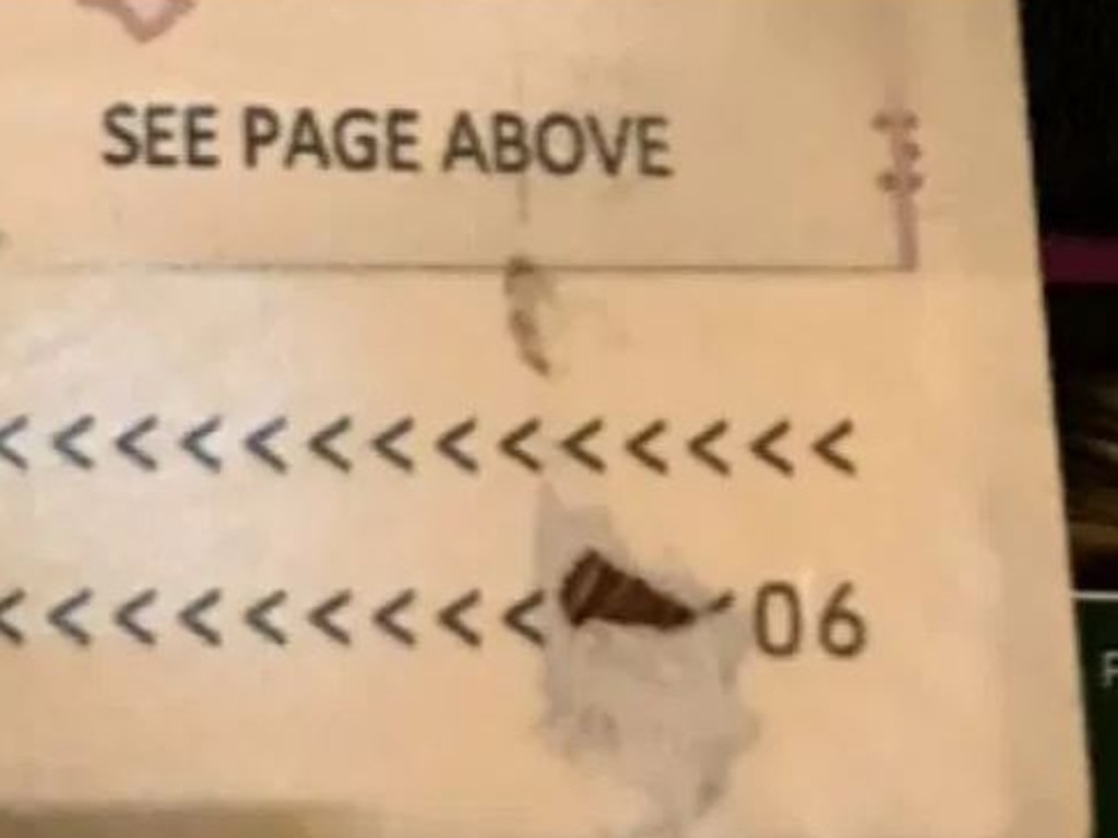 The tear in Mr Lane's passport.