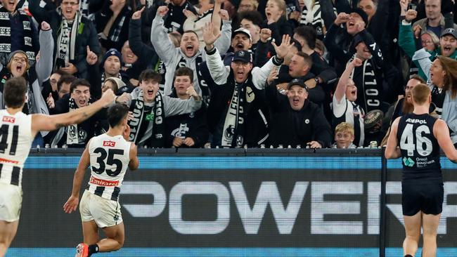 Nick Daicos celebrates the winning goal after tearing away from Carlton midfielders at a crucial late stoppage in the Magpies’ round 8 win. Picture: Dylan Burns / Getty Images