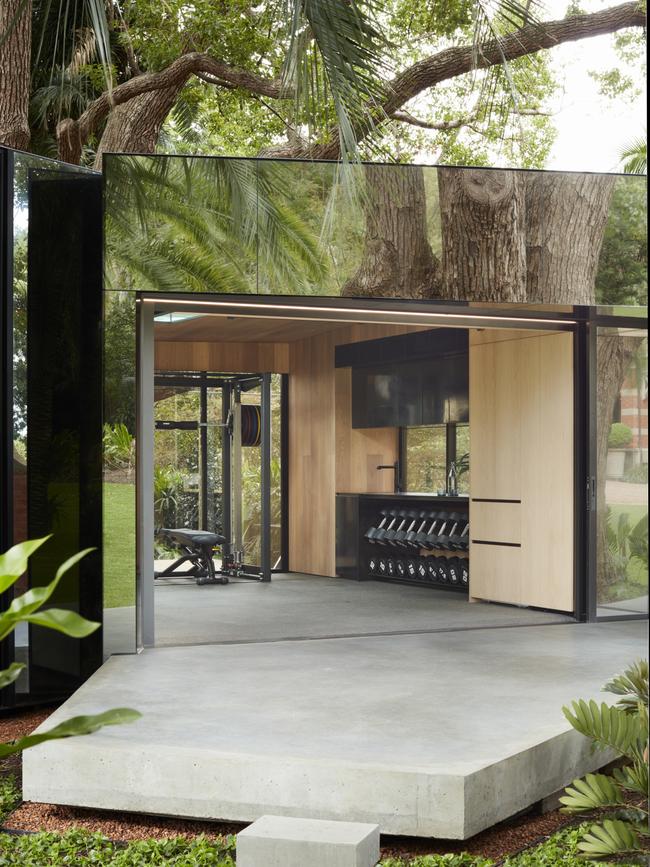 Luxurious home gym in an indoor/outdoor setting. Photo: Prue Ruscoe