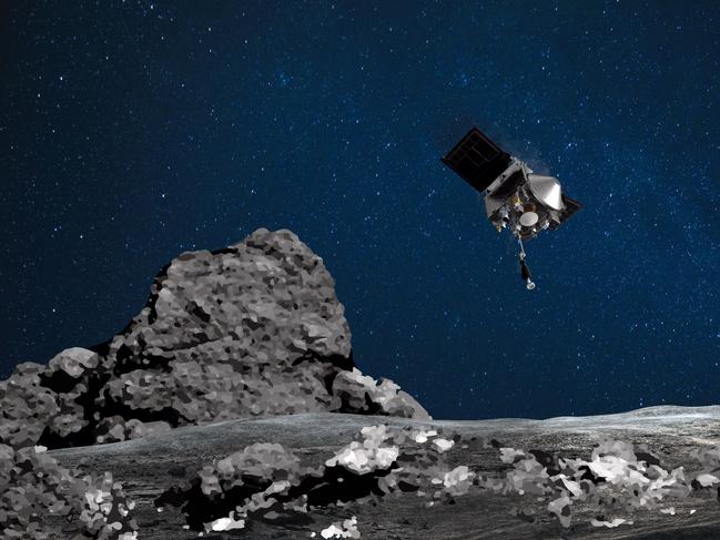 (FILES) This NASA file image obtained August 11, 2020 shows an artist's rendering of the OSIRIS-REx spacecraft descending towards asteroid Bennu to collect a sample of the asteroidâs surface. - The big day has arrived for the American probe Osiris-Rex: after four years of travel, it will hit the asteroid Bennu on October 20, 2020 to pick up a few tens of grams of dust, a high-precision operation 320 million kilometers away from Earth . (Photo by Handout / NASA/Goddard/Arizona State University / AFP) / RESTRICTED TO EDITORIAL USE - MANDATORY CREDIT "AFP PHOTO /NASA/GODDARD/UNIVERSITY OF ARIZONA/HANDOUT " - NO MARKETING - NO ADVERTISING CAMPAIGNS - DISTRIBUTED AS A SERVICE TO CLIENTS