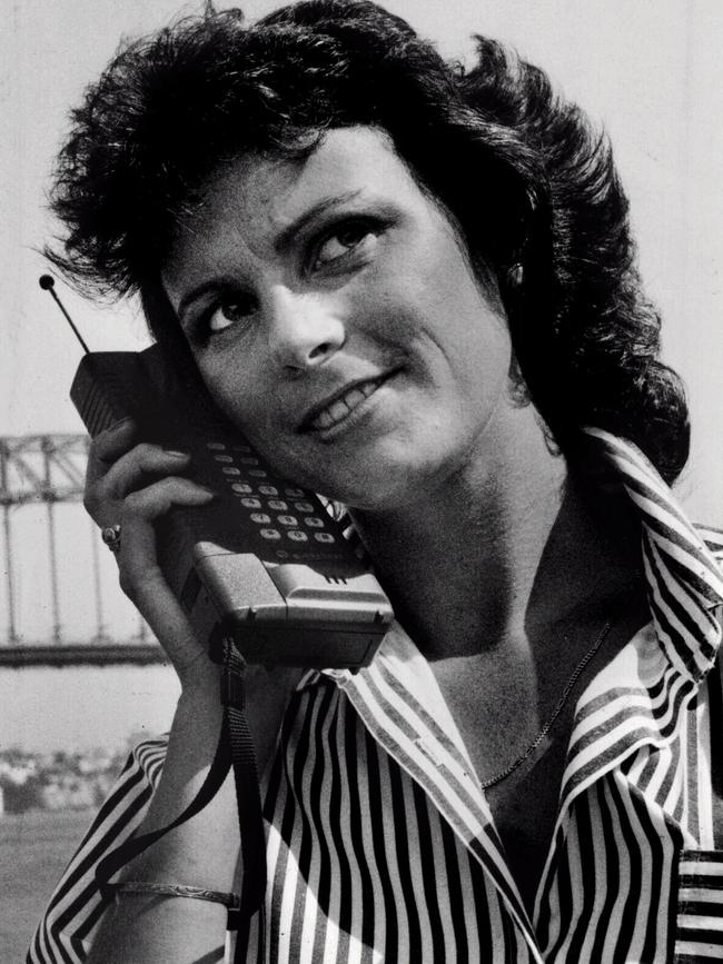 A woman with a mobile phone in about 1989.