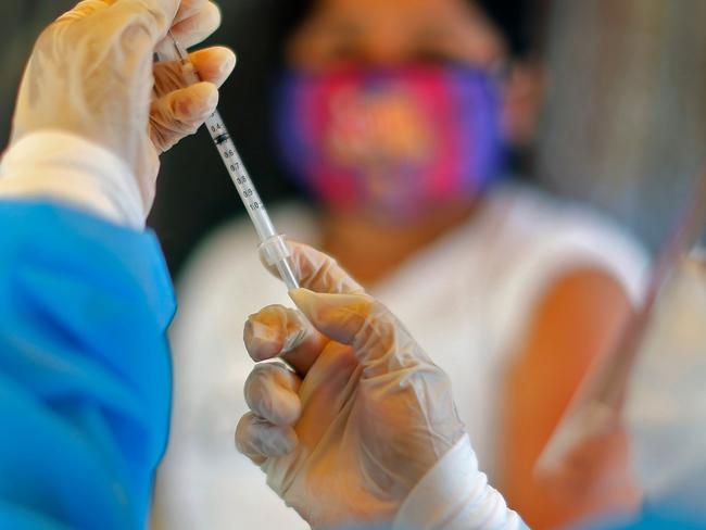 A health worker prepares a vaccine against diphtheria in Lima, on October 28, 2020, after a case was detected at a popular district. - Peru has launched a national epidemiological alert after detecting its first case of diphtheria in 20 years, the health ministry said on Wednesday. (Photo by Luka GONZALES / AFP)