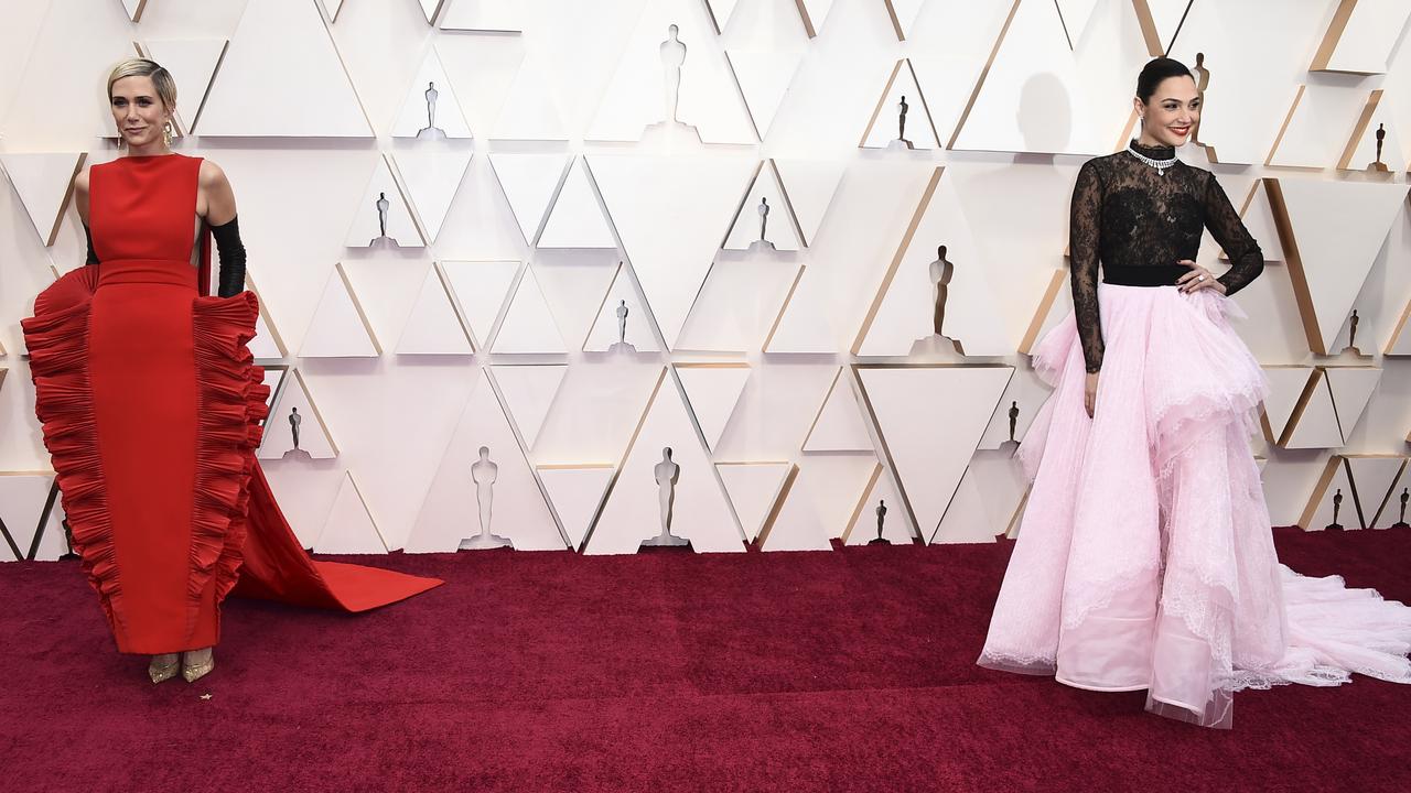 Kristen Wiig, left, and Gal Gadot arrive at the Oscars on Sunday, Feb. 9, 2020, at the Dolby Theatre in Los Angeles. (Photo by Jordan Strauss/Invision/AP)