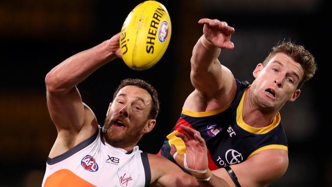 Shane Mumford competes with Josh Jenkins in the ruck. Picture: James Elsby/AFL Photos/Getty Images