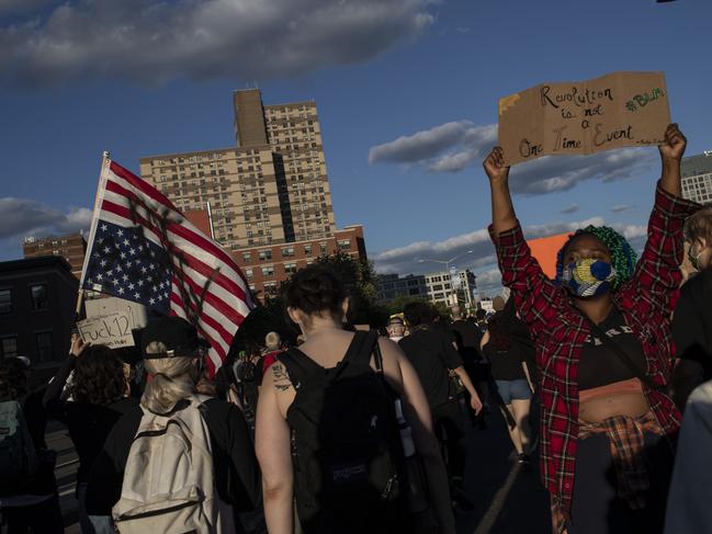 Protesters march down the street during a solidarity rally for George Floydin the Brooklyn borough of New York. Picture: Wong Maye-E