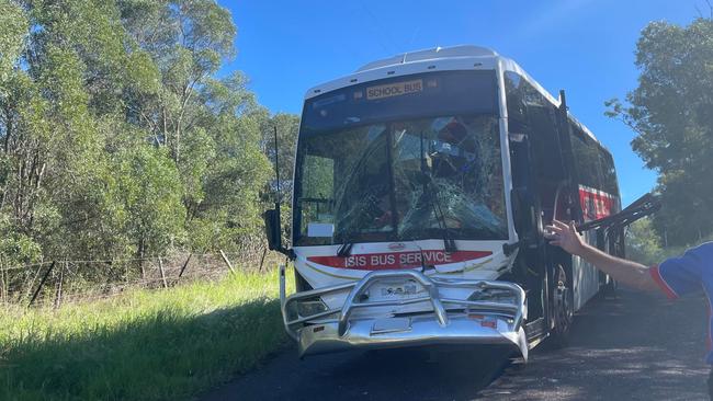 Nine children and one adult have been treated at the scene after a bus and tractor collision at South Isis.