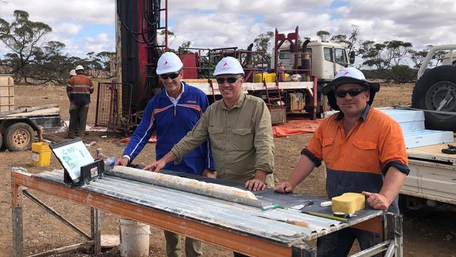 Drill core being examined at Andromeda Metals' Poochera kaolin project.