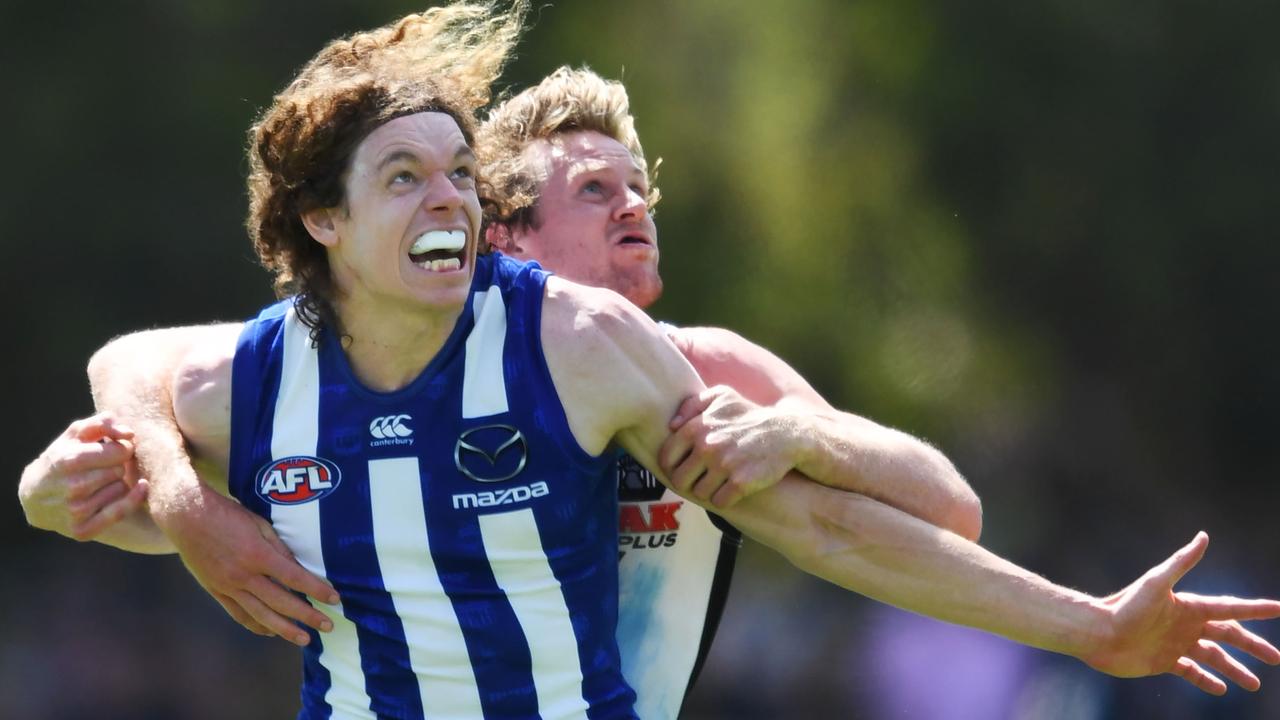 Tom Jonas of Port Adelaide holds Ben Brown of the Kangaroos.