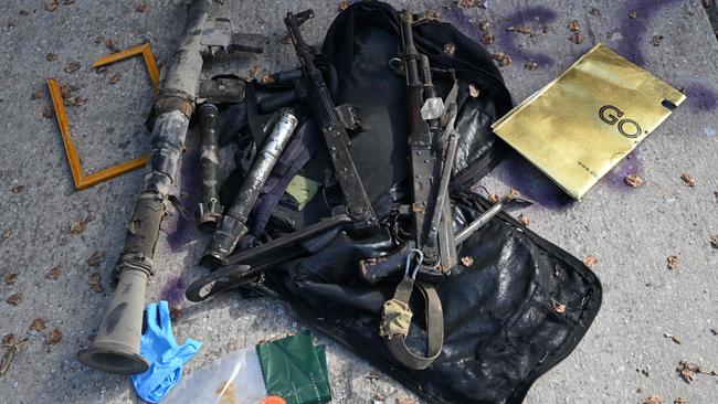 Weapons lie on the ground in Kibbutz Beeri near the border with the Gaza Strip on October 15, 2023, after the October 7 attack by Palestinian militants. Picture: Yuri Cortez/AFP