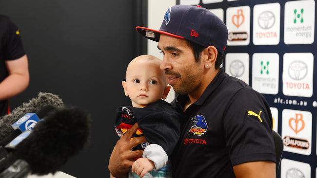 Eddie Betts with son Lewis at his first press conference as a Crow in October, 2013. Picture: Luke Hemer.