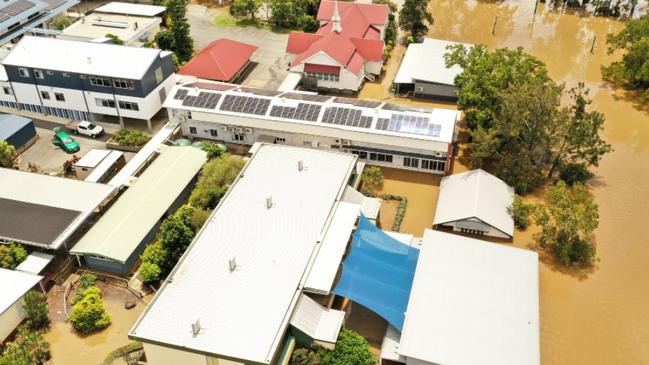 An aerial shot of One Mile School at the peak of the flood on Sunday, February 27, 2022 taken by Infinity Flights Photography, which shows the extent of the disaster which has forced almost half of the student cohort to be bussed to another school.