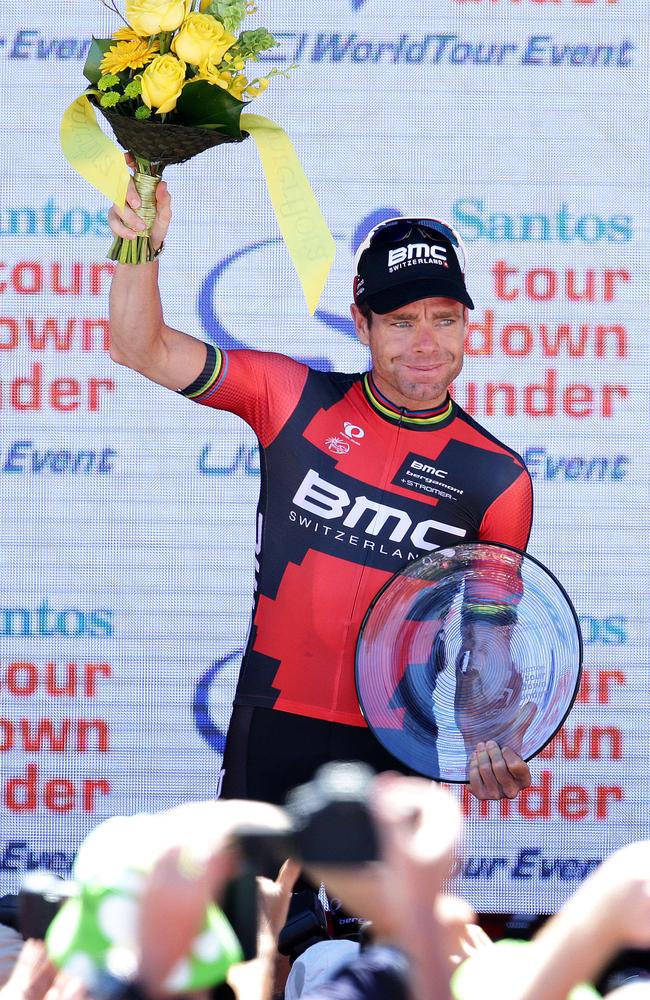 Cadel Evans poses with a bouquet and a plate after finishing third in the Tour Down Under.