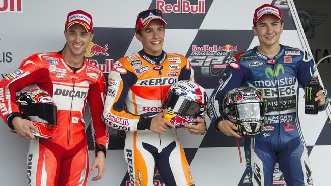 Andrea Dovizioso of Italy and Ducati Team, Marc Marquez of Spain and Repsol Honda Team and Jorge Lorenzo of Spain and Movistar Yamaha MotoGP pose at the end of the qualifying practice.