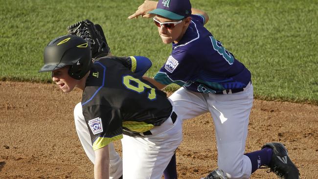 Australia's William Unitt (9) slides safely into second ahead of the tag by Italy shortstop Alessandro Beccari. Picture: AP