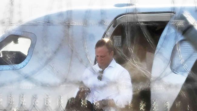 QLD Premier Steven Miles and staff exit a private jet at the Government Air Wing, Brisbane Airport. Picture: Lyndon Mechielsen