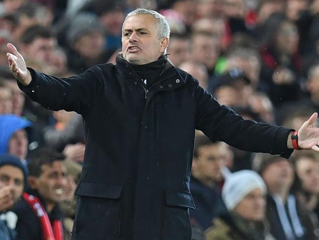 Manchester United's Portuguese manager Jose Mourinho gestures on the touchline during the English Premier League football match between Liverpool and Manchester United at Anfield in Liverpool, north west England on December 16, 2018. (Photo by Paul ELLIS / AFP) / RESTRICTED TO EDITORIAL USE. No use with unauthorized audio, video, data, fixture lists, club/league logos or 'live' services. Online in-match use limited to 120 images. An additional 40 images may be used in extra time. No video emulation. Social media in-match use limited to 120 images. An additional 40 images may be used in extra time. No use in betting publications, games or single club/league/player publications. /