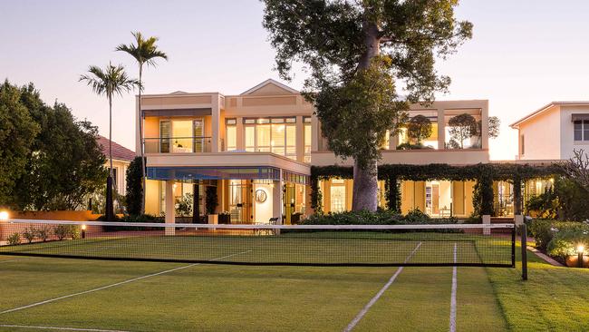 The Brisbane riverfront home at 98 Virginia Ave’s private grass tennis court.