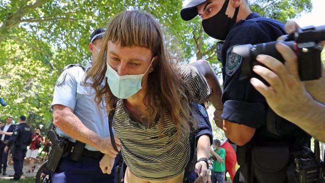 Police arresting a protester at The Domain. Picture: Richard Dobson