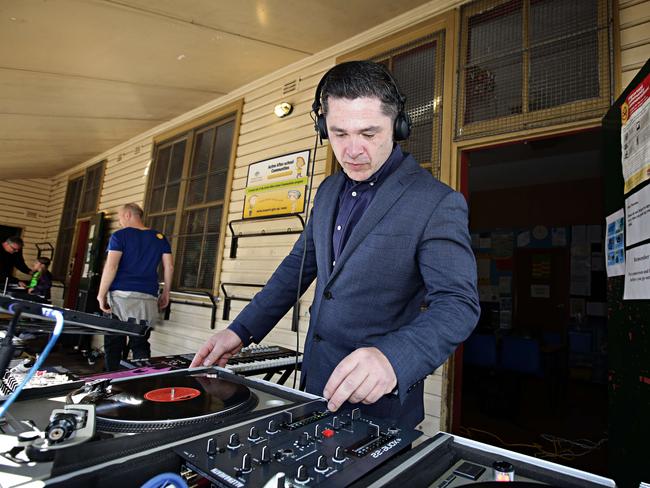 Greens candidate for Grayndler Jim Casey DJing at Annandale Public School as people vote for the federal election. Picture: Adam Yip