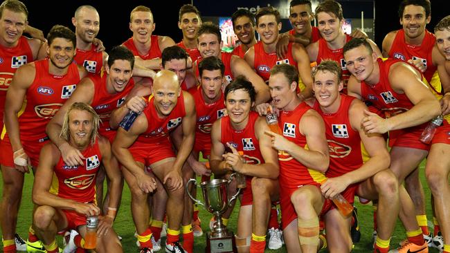 Gold Coast celebrate a QClash win in 2014. Picture: Adam Head