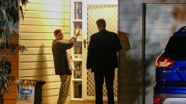 Police talk to neighbours. Picture: Ian Currie