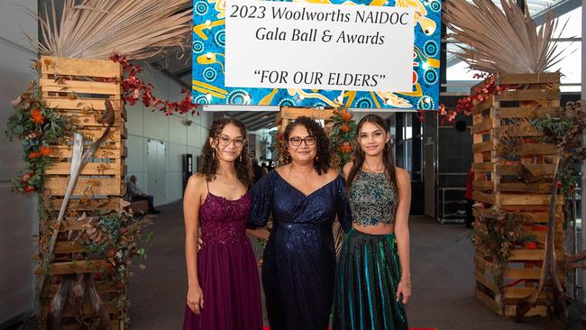 Pearl Bonson, Naomi Anstess and Lilli Bonson take a snap before entering the Darwin Convention Centre event. Picture: Pema Tamang Pakhrin