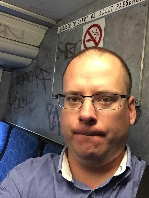 Leader reporter Andrew Rogers enjoys the view of bus graffiti.