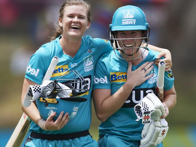 They’ve got the write stuff … Brisbane Heat stars Jess and Beth celebrate a Big Bash victory against the Perth Scorchers in November 2019.