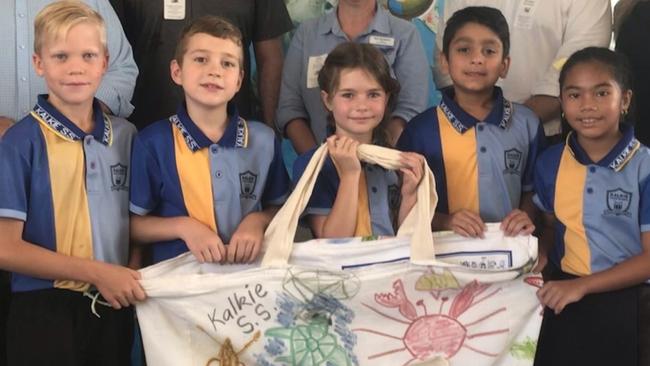 Kalkie State School students and staff with Mayor Jack Dempsey, GBRMPA CEO Josh Thomas and chief scientist Dr David Wachenfeld.