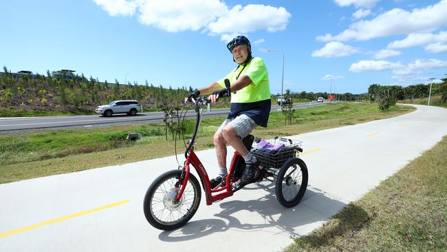 The incessant thumping noise created by vehicles driving over the Smithfield bypass have been driving local residents crazy. Kevin Coombes rides his tricycle along the bypass bike path a few times a week, and says that the noise isn't annoying. Picture: Brendan Radke