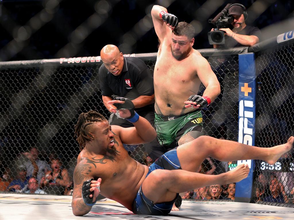 Tai Tuivasa of Australia (top) takes down Greg Hardy in the first round in their heavyweight bout during UFC 264: Poirier v McGregor 3. Picture: Stacy Revere/Getty Images)