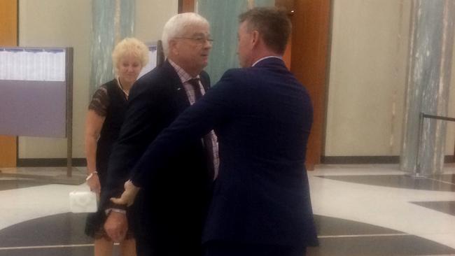 James Ashby and Senator Brian Burston clash in Parliament House last year.