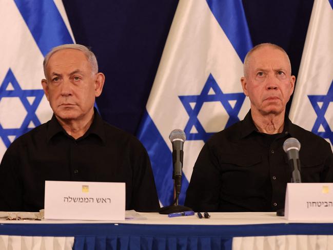 (FILES) Israeli Prime Minister Benjamin Netanyahu (L) and Defence Minister Yoav Gallant attend a press conference in the Kirya military base in Tel Aviv on October 28, 2023 amid ongoing battles between Israel and the Palestinian group Hamas. The International Criminal Court on November 21, 2024 issued arrest warrants for Israeli Prime Minister Benjamin Netanyahu and Defence Minister Yoav Gallant, as well as a Hamas' military chief. (Photo by Abir SULTAN / POOL / AFP)