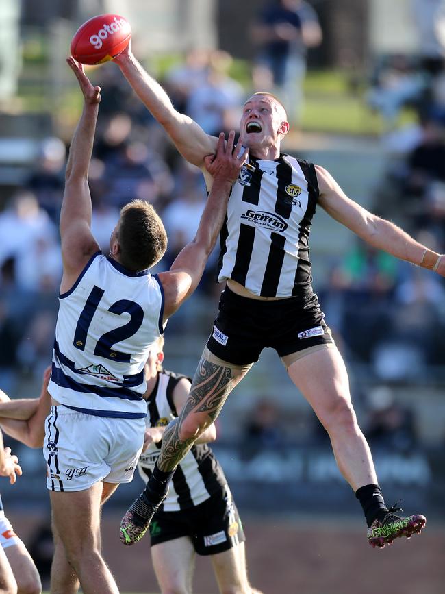 Wangaratta’s Callum Moore leaps over Yarrawonga’s Lachlan Howe in last year’s Ovens and Murray grand final. Picture: Yuri Kouzmin