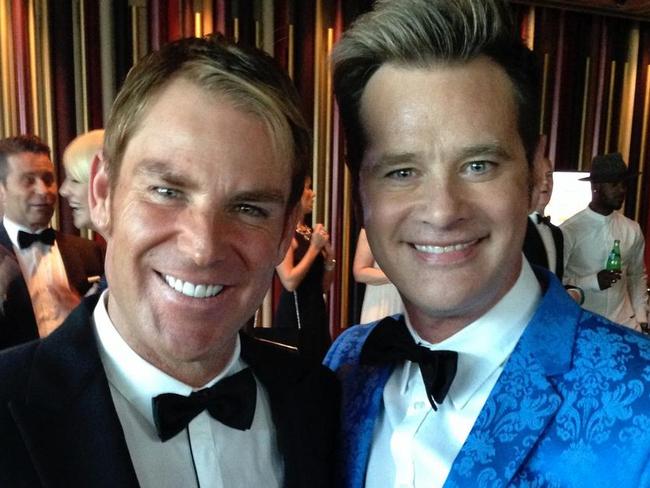 Reid with Shane Warne.