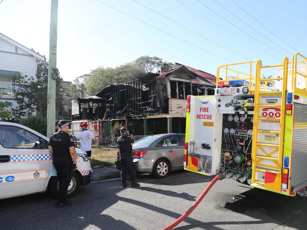 Police and firefighters at the house fire. Pic Peter Wallis