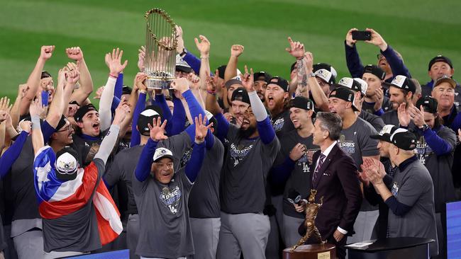 The Los Angeles Dodgers celebrate with the trophy. (Photo by Luke Hales/Getty Images)