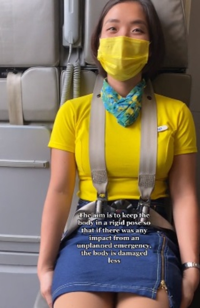 Reason why cabin crew sit on their hands is revealed