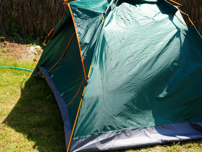 Green Camping tent on green park campsite