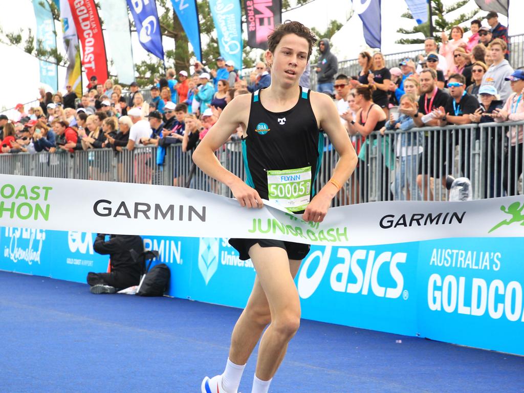 Flynn Pumpa winning the Garmin 4km Junior Dash.