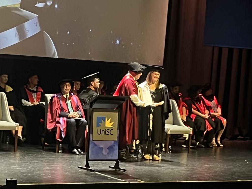 Graduates from the University of the Sunshine Coast's Fraser Coast campus celebrating at the Brolga Theatre.