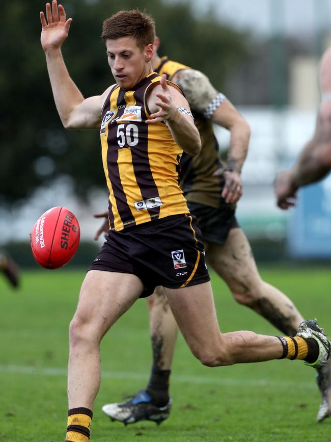 Damian Mascitti of Box Hill kicks a goal on the run.