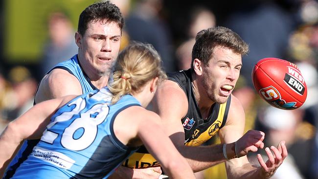 Glenelg’s Chris Curran battles Sturt's Jed McEntee and Jack Penfold. Picture: Sarah Reed