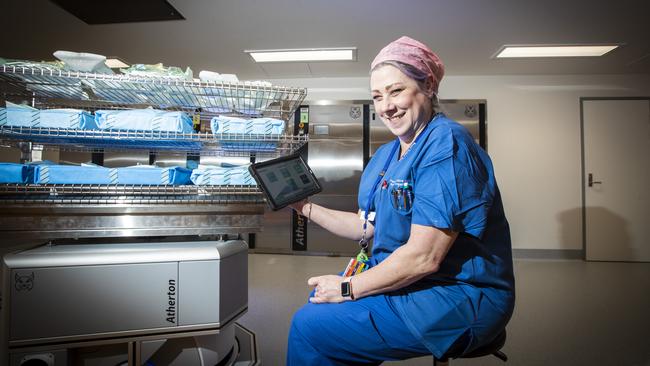 Nurse unit manager Rachuel Manning with the new Atherton Lynx cleaning robot at the Royal Hobart Hospital. Picture: LUKE BOWDEN