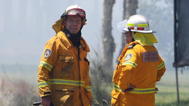 Mr Abbott with his Davidson Brigade fighting a bushfire at Salt Ash in 2018. Picture: Dan Himbrechts