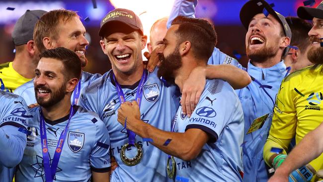 Alex Brosque celebrating Sydney’s grand final win with teammates. Picture: Getty Images