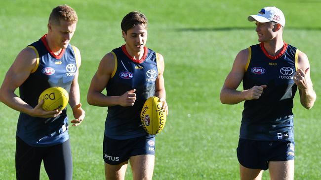 Alex Keath, right, with teammates Reilly O’Brien and Jake Kelly at Crows training.