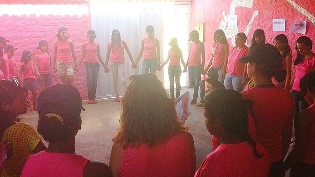 Girls take part in therapy called the "conversation circle" at the Pink House. Not all the girls in this photogr...