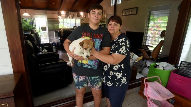 Kim Love with son Cameron, 16, and dog Kevin were rescued by a neighbour from rushing flood water from their Balgal Beach home. Picture: Evan Morgan